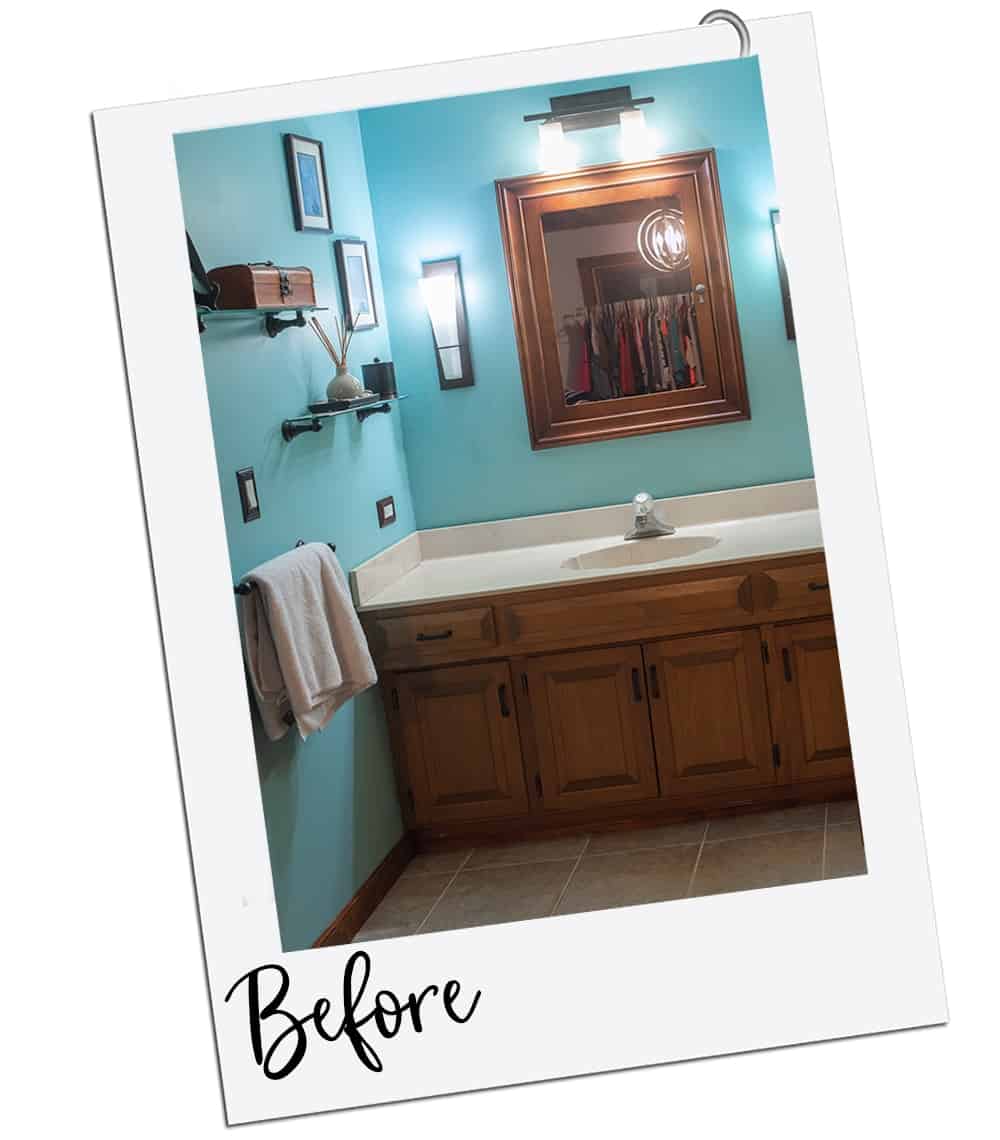Outdated blue bathroom with wood and seashell vanity.