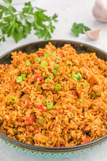 Side view of Spanish rice or arroz rojo with chorizo.
