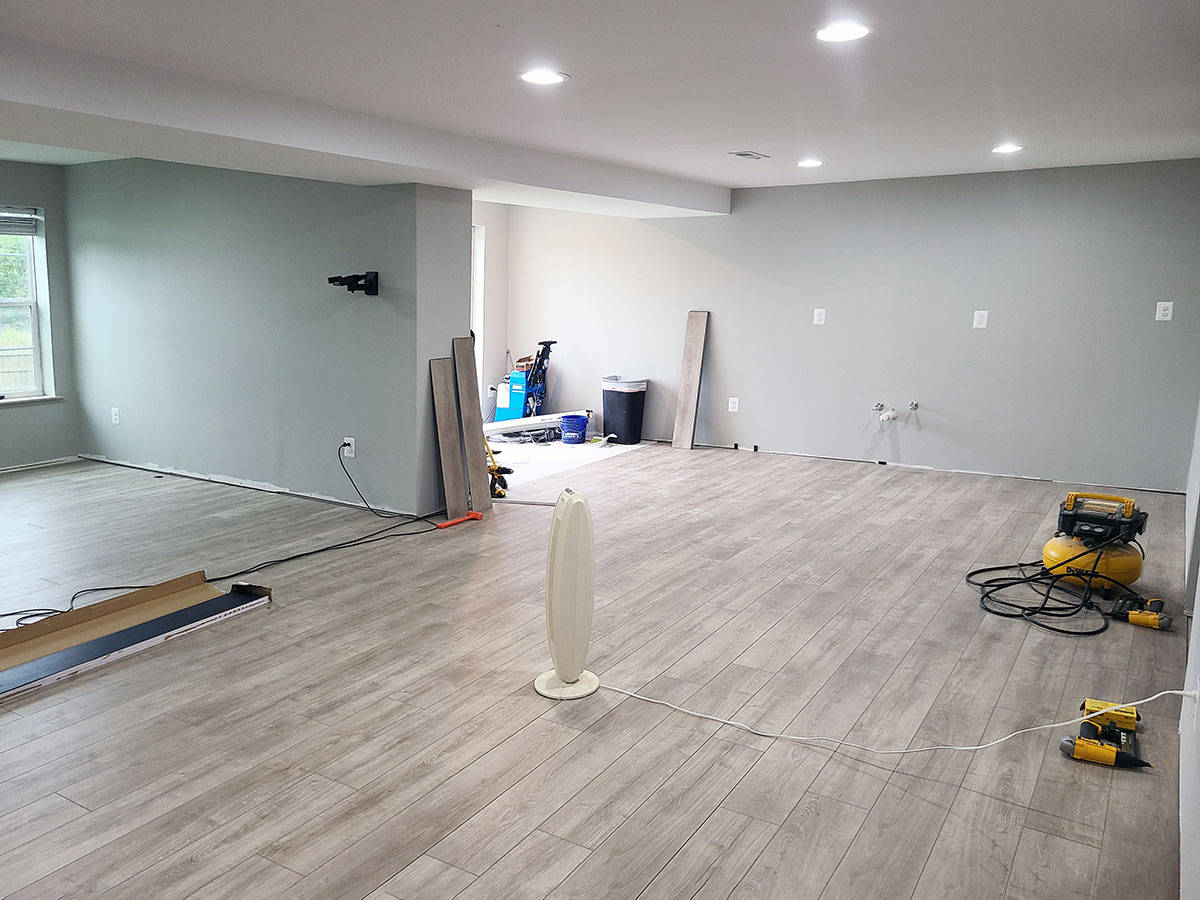 Rigid plank vinyl floors in a large room.
