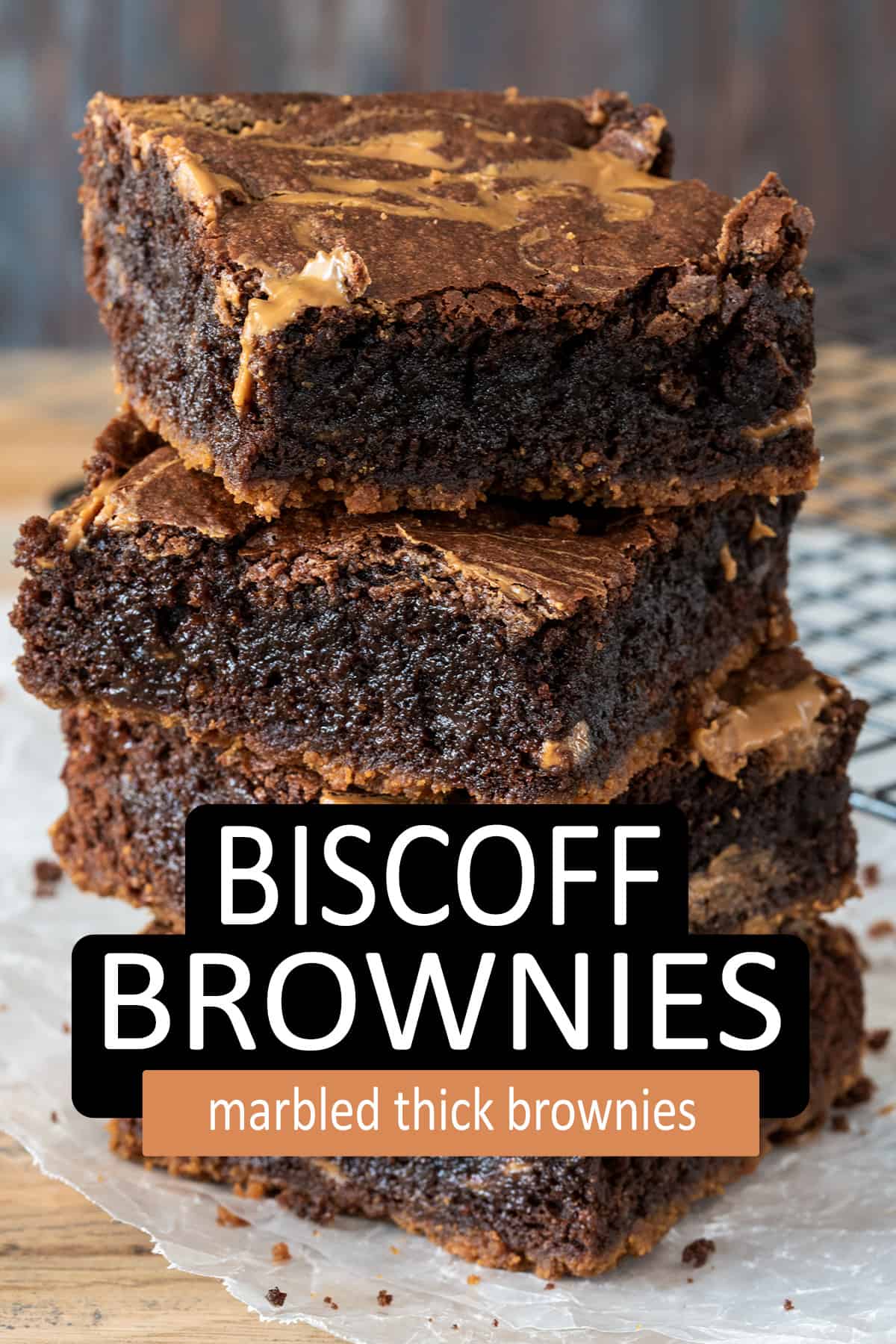 Biscoff Brownies stacked on parchment paper.