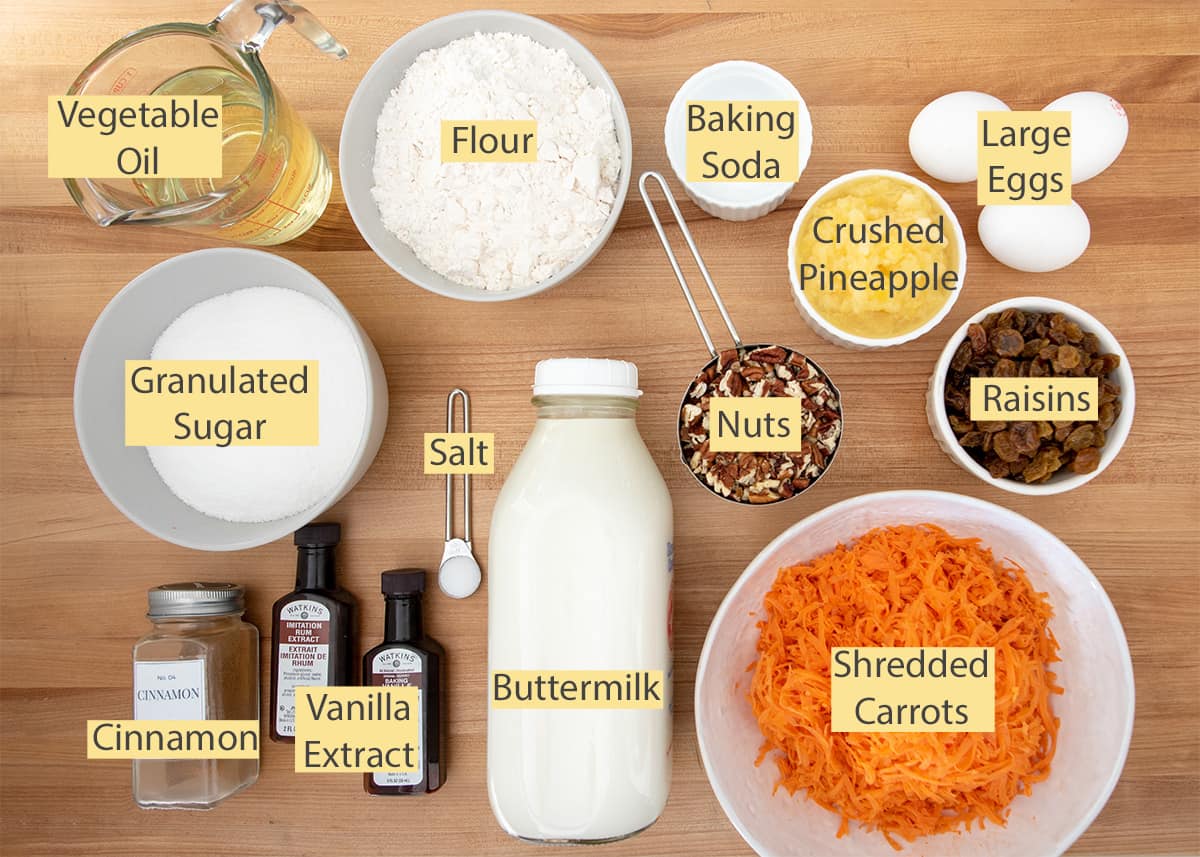 Carrot Cake Ingredients laid out on a table with text labels.