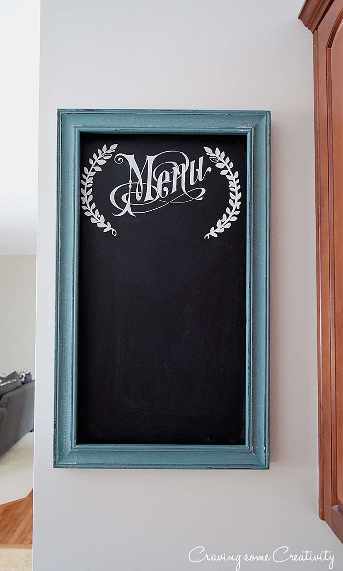 DIY menu chalkboard in kitchen with rustic turquoise frame