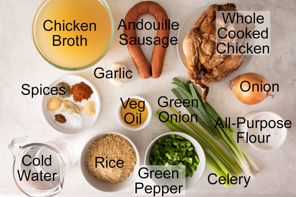 Ingredients for chicken and sausage Cajun gumbo laid out on a table.