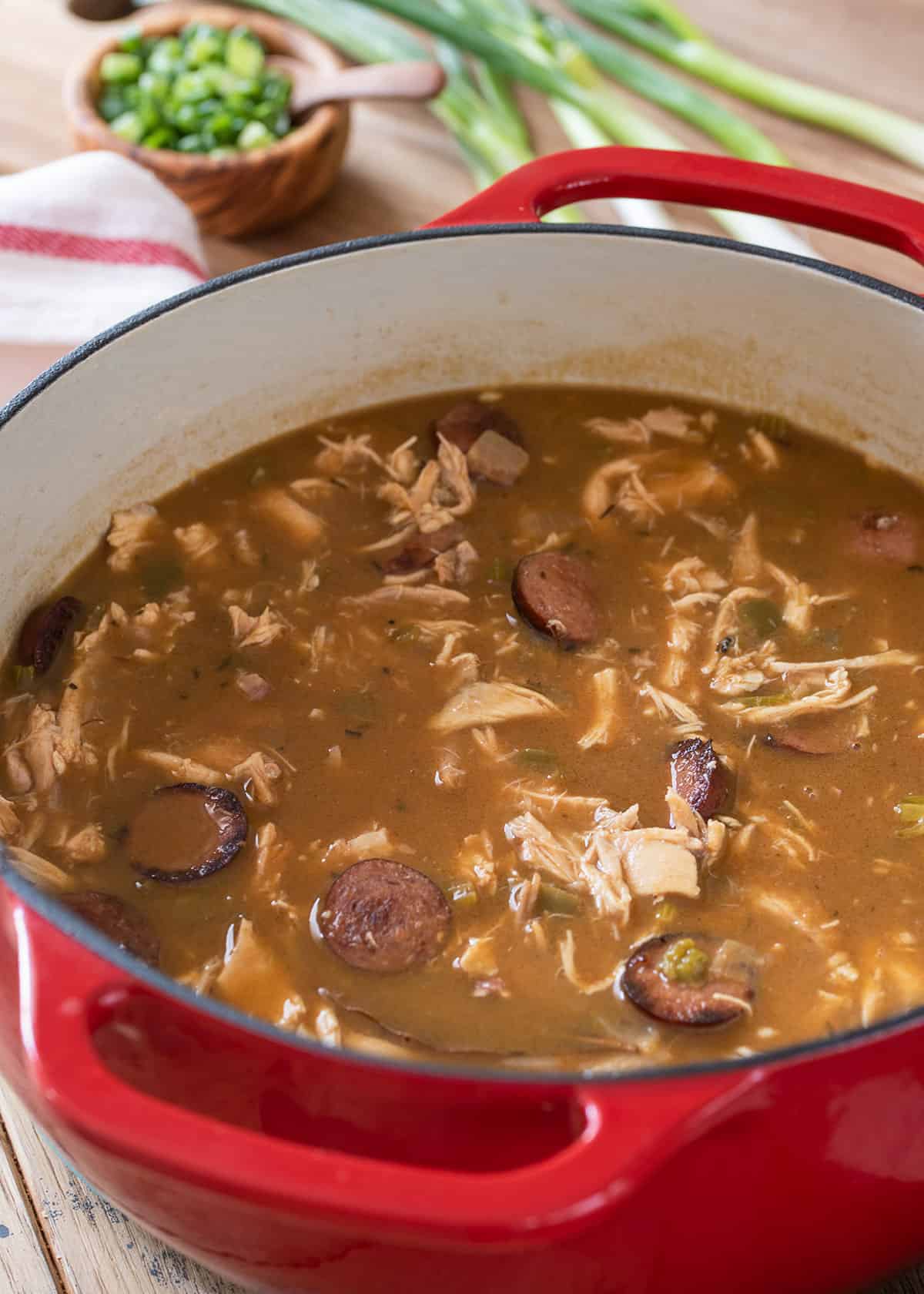 A stock pot of chicken and sausage gumbo after it is finished cooking.