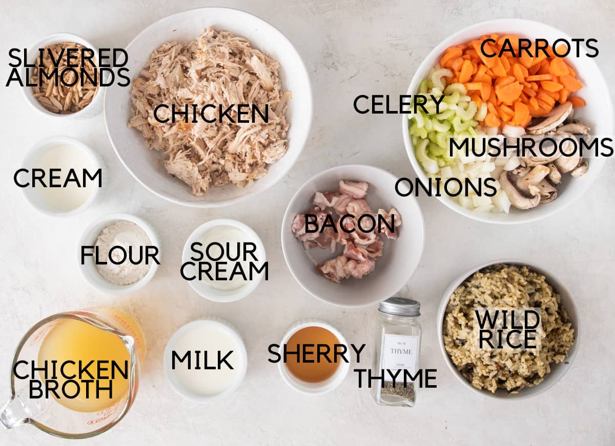 Ingredients for chicken and rice soup laid out on a table.