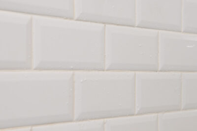 A cleaning paste solution sitting on white tile.