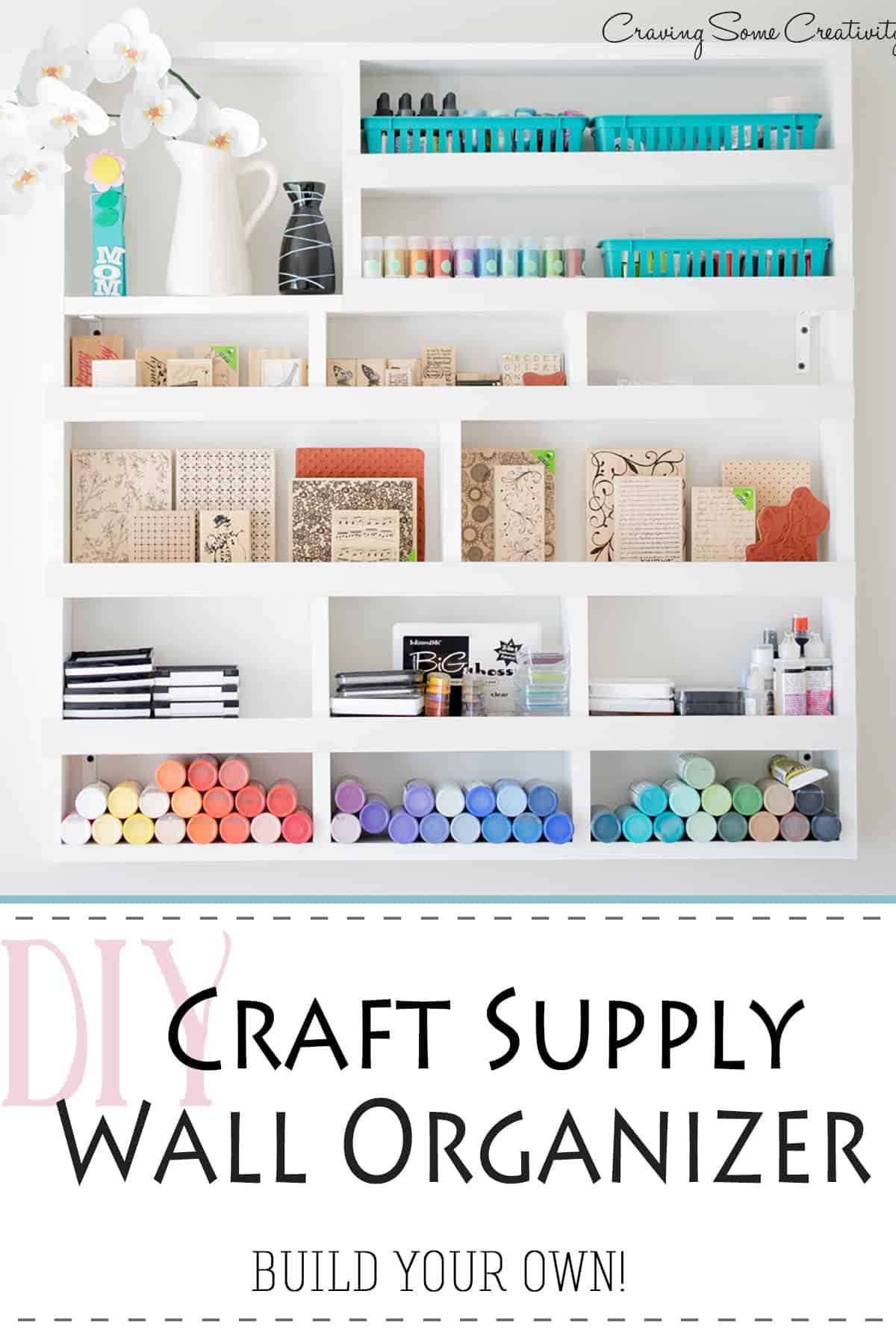 DIY white wall shelf with colorful craft supply organization.