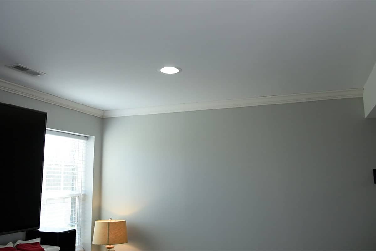 A blank grey wall with crown molding at the top.
