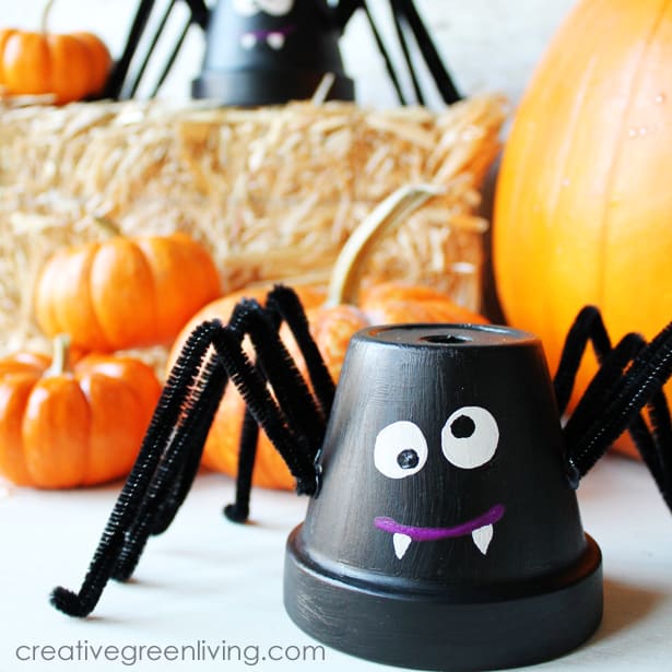 A diy spider craft made from a flower pot and pipe cleaners.