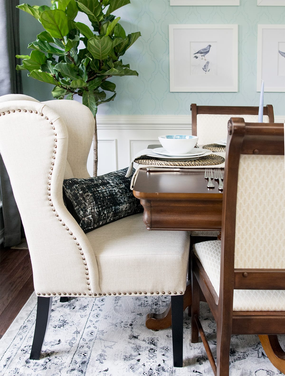 Classic chic dining room with intricate blue dining room wall details.