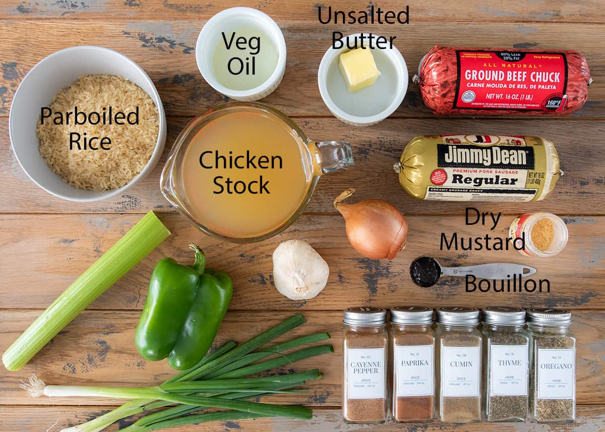 Ingredients for classic Cajun dirty rice recipe laid out on a table with labels.