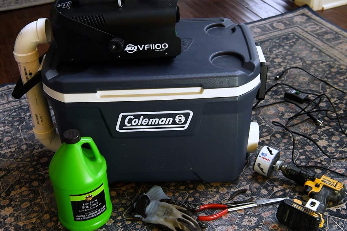 Supplies needed for a fog chiller including cooler, fog machine, fog juice, and tools.