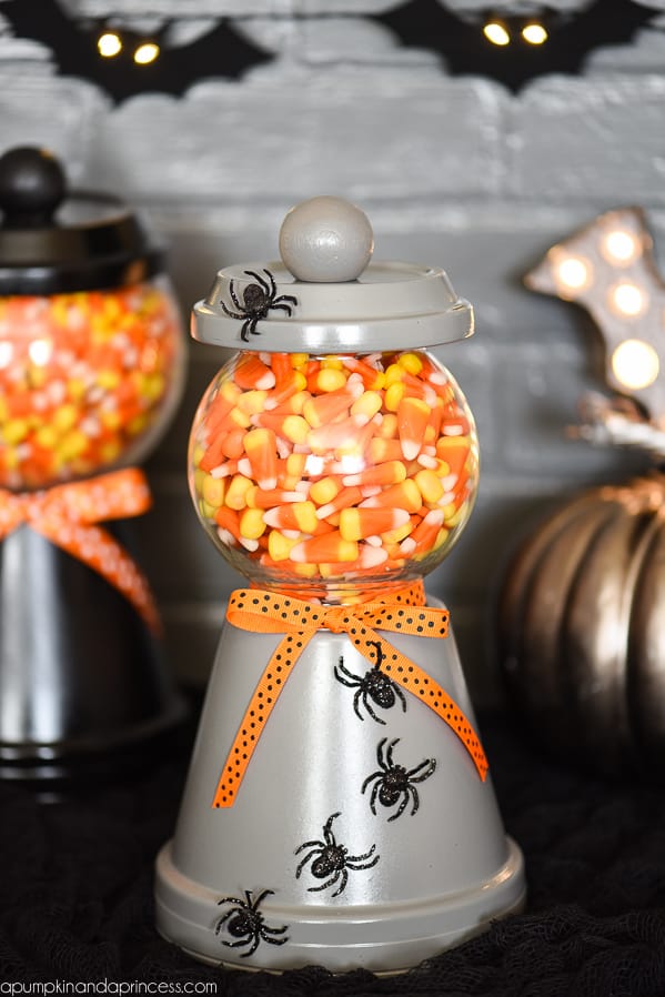 Candy corn in a jar made from plant pots.