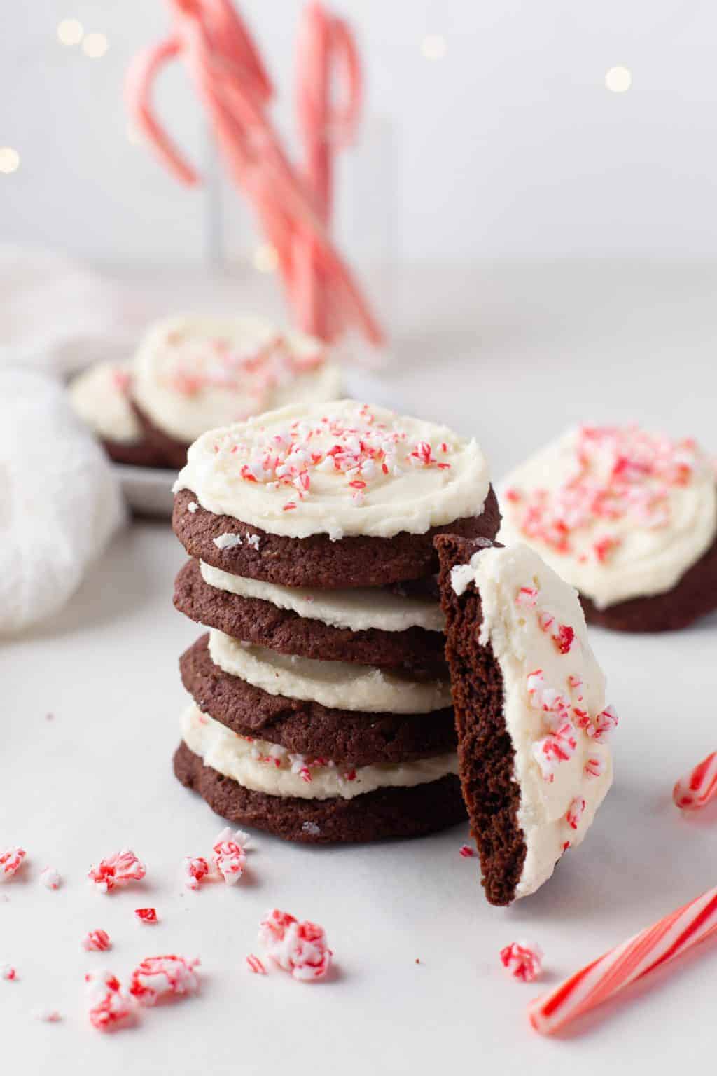 A stack of chocolate peppermint cookies with peppermint frosting.