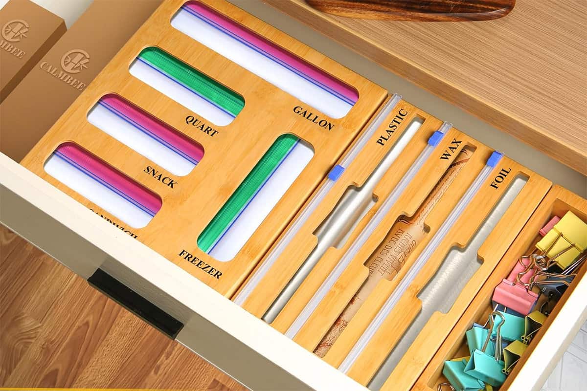 An open drawer with a food bag and foil paper organizer in it for food storage.