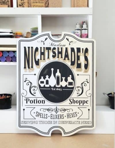 A wooden apothecary witch sign cut to size.