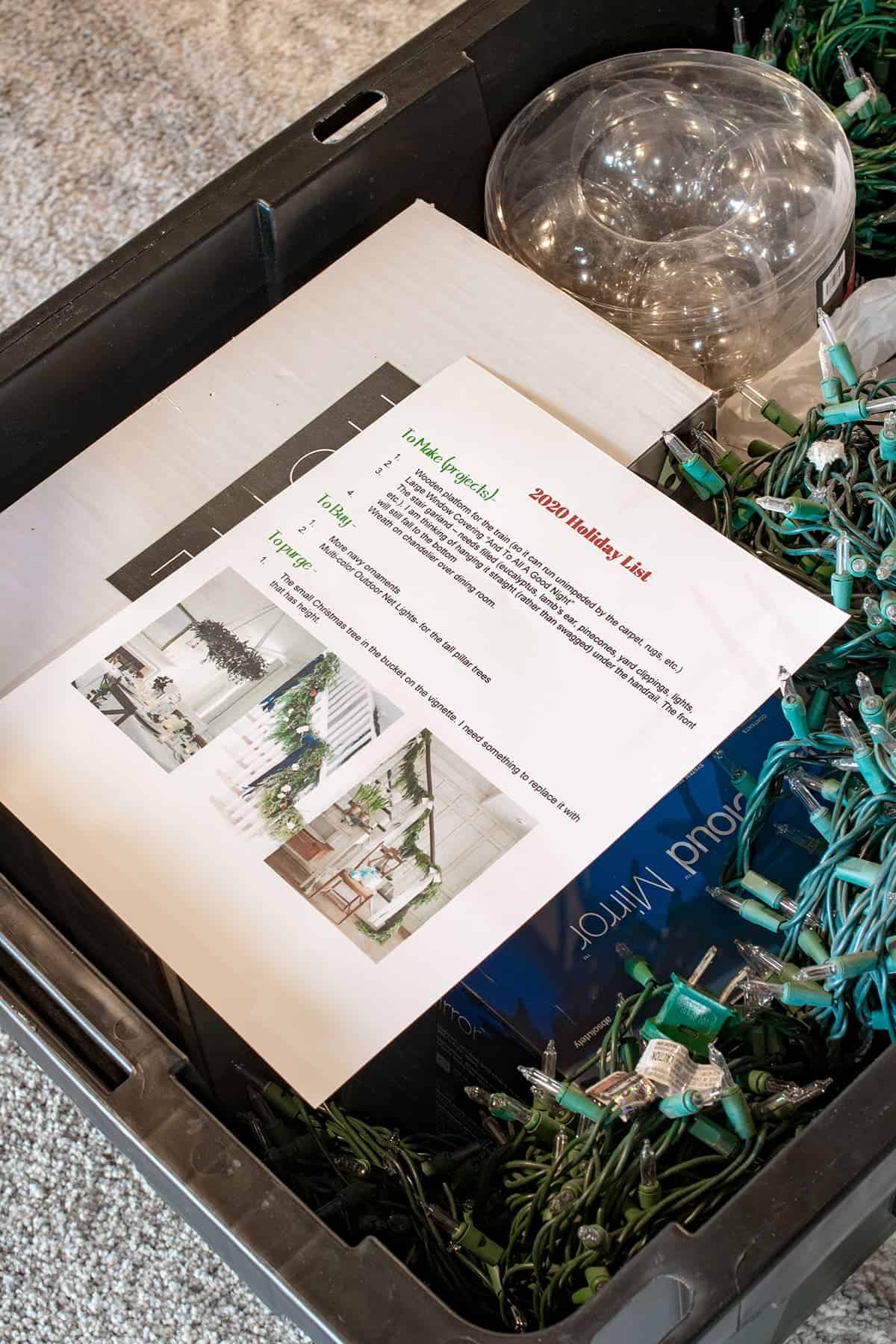 Close up of open storage bin with items neatly packed and holiday list for next year's needs and projects on top.