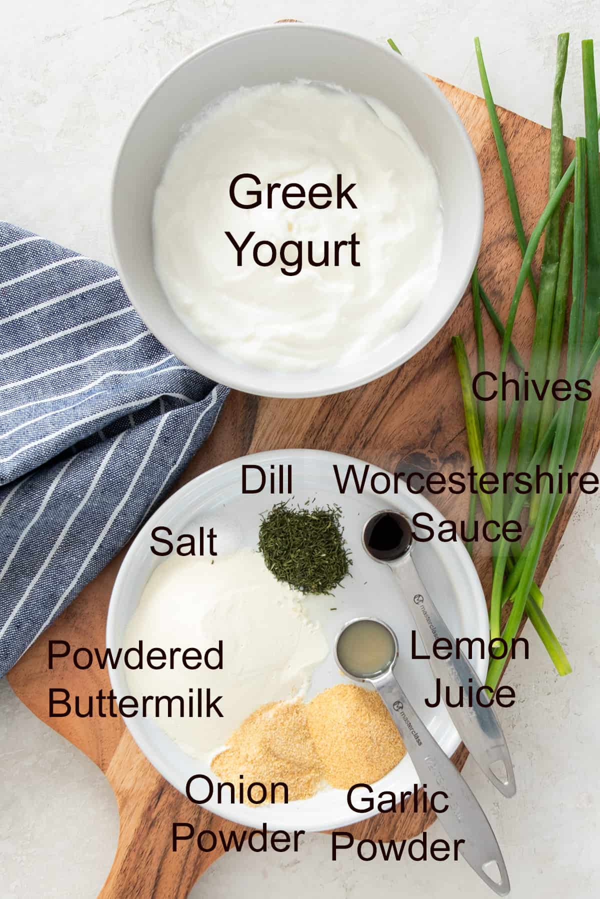 Ingredients to make homemade ranch dressing laid out on a platter.