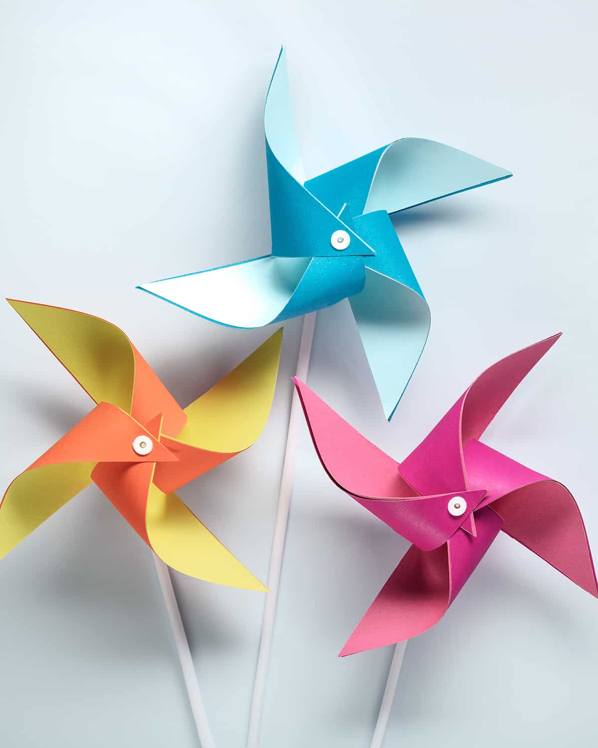 Three DIY Windmills craft on white backgroubd.