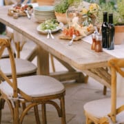 Wood table and chairs decorated for a party with the wood being sealed and waterproofed.