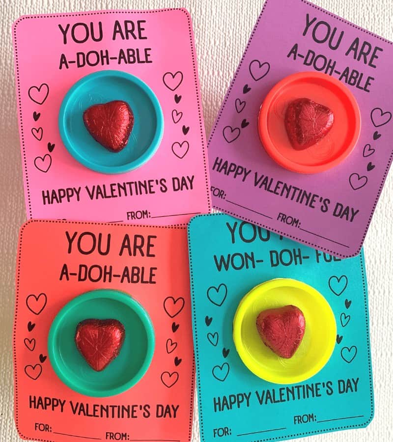 Playdoh diy Valentine's Day card with candy heart that reads you are a-doh-able.