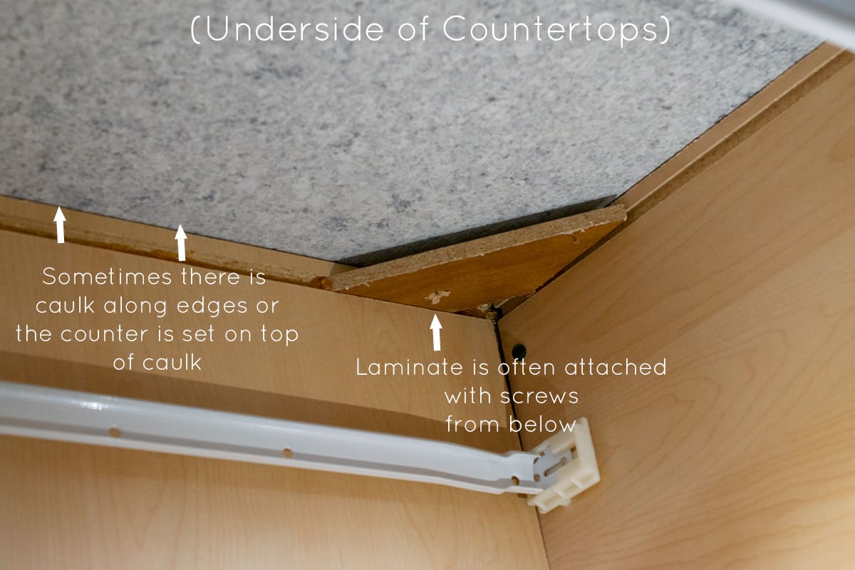 Demonstrating how to remove countertops by showing where they attach.