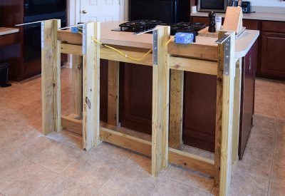 Framing to build a kitchen island including new outlets.