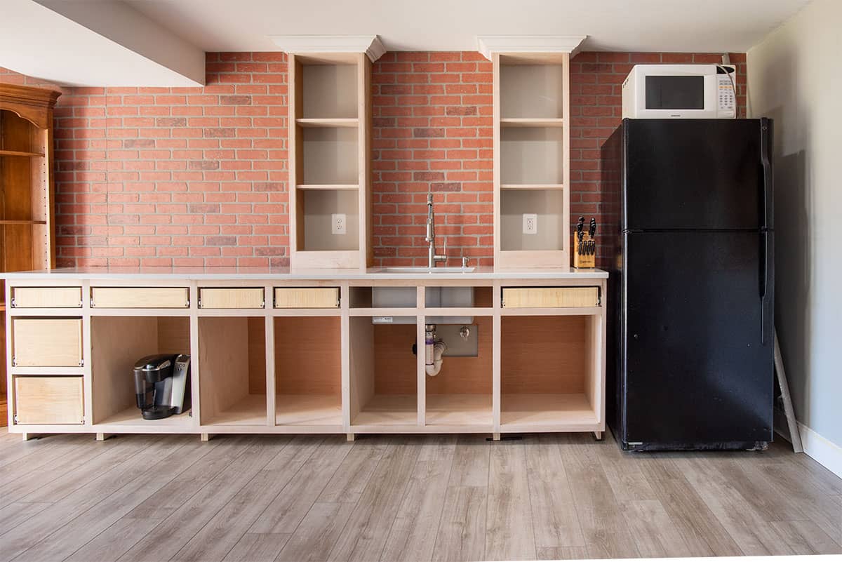 Faux brick wall panels in kitchen area.