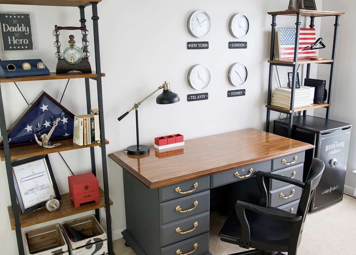 Masculine Office with Patriotic decor theme. World Wall clocks, Antique desk in Telegram gray, and Americana decorations on the shelves.