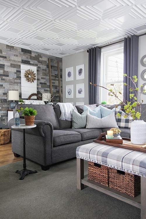 Modern white square style drop down pop out ceiling styles in a modern farmhouse styled living room with gray neutral palette.