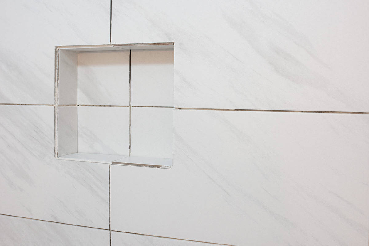 A shower niche with modern clean lines and no accent tile.