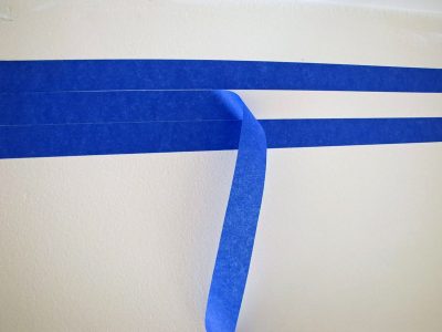 Using Painter's tape to make 1 inch straight lines evenly.