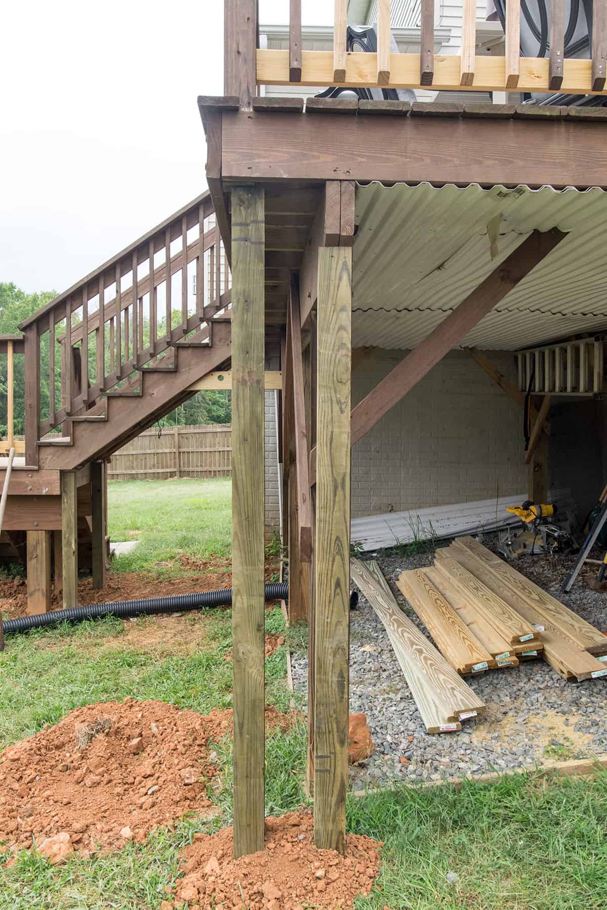 Progression of framing a deck to create a storage enclosure underneath.