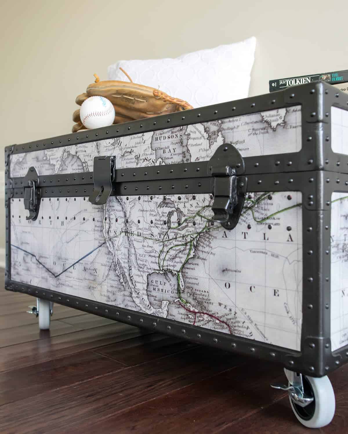 Vintage military trunk makeover with world map showing the front side. Painted with Rust oleum oil rubbed bronze metal paint.