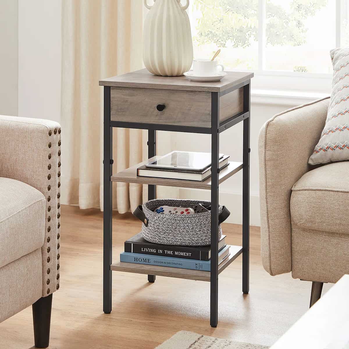 Modern rustic nightstand in light gray finish with industrial black pipes and two open shelves next to a couch.