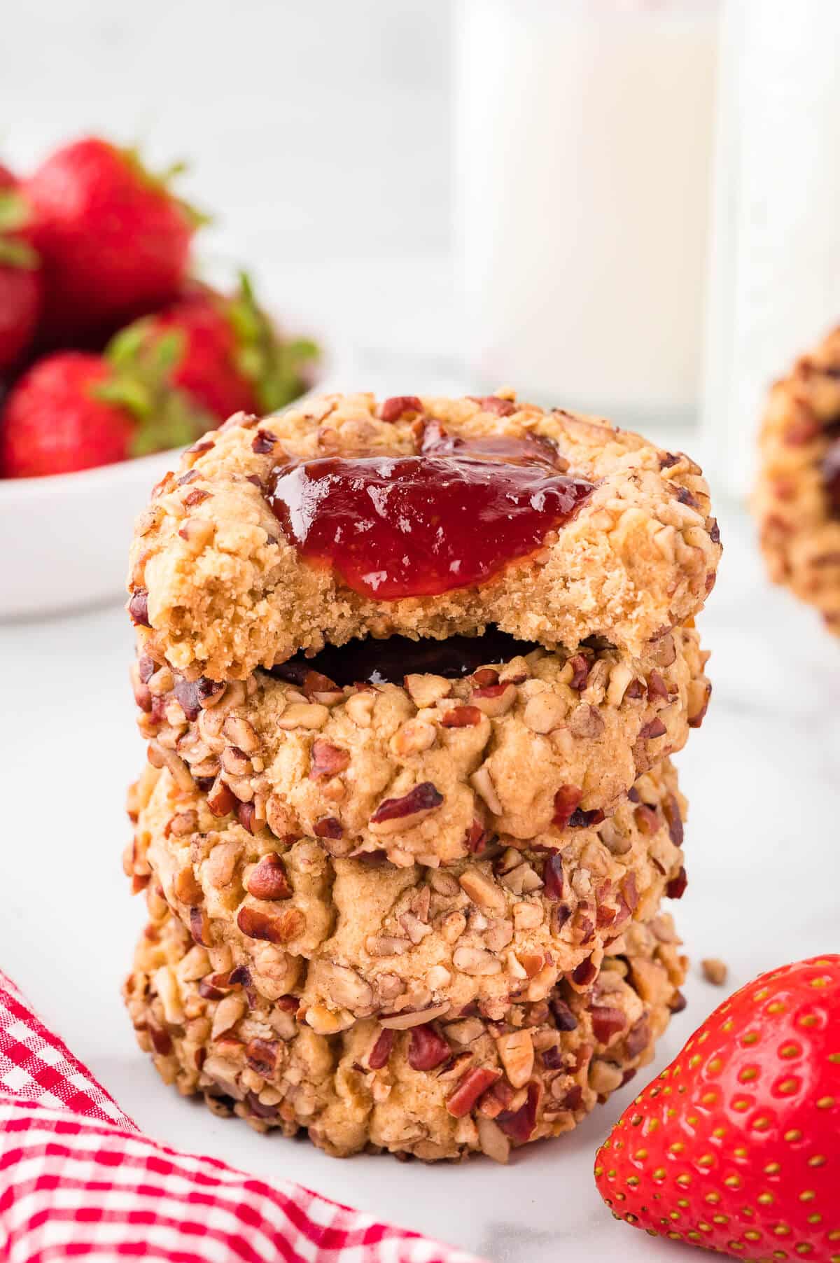 Jam filled thumbprint cookies with nuts on top.