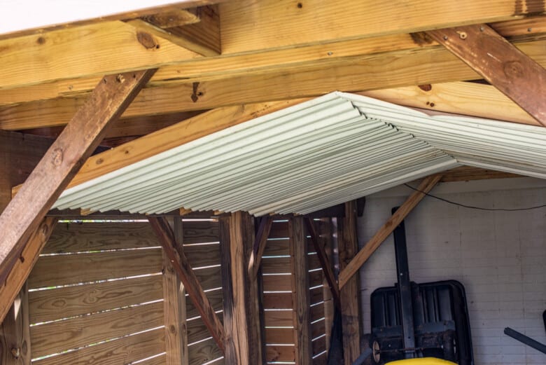 Ceiling under deck with knee braces to keep rain out.