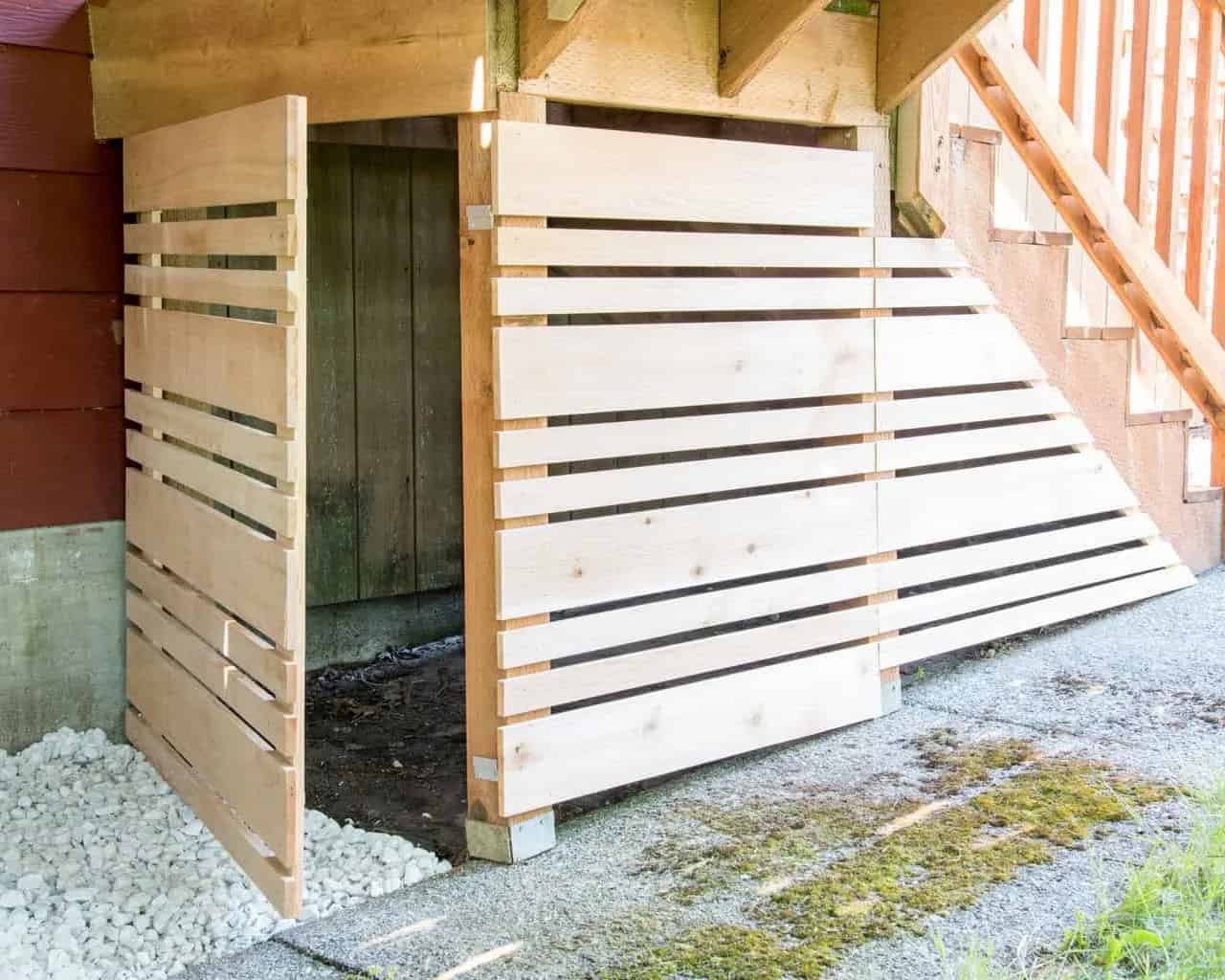 Under stair section covered with a removeable panel.