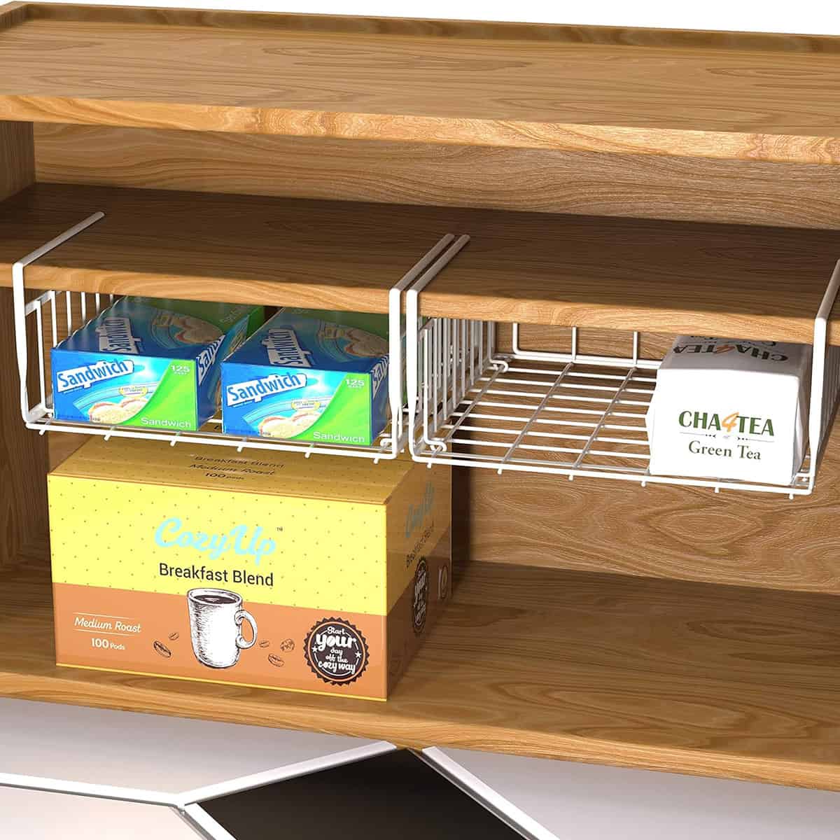 Under shelf baskets made of wire with tea and coffee supplies in them.