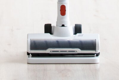 Closeup of vacuum on floor.