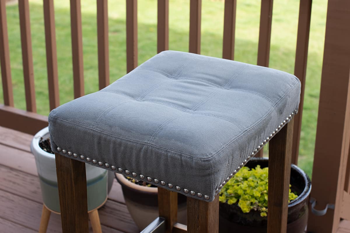 Barstool saturated with waterproofing spray and sitting outside.