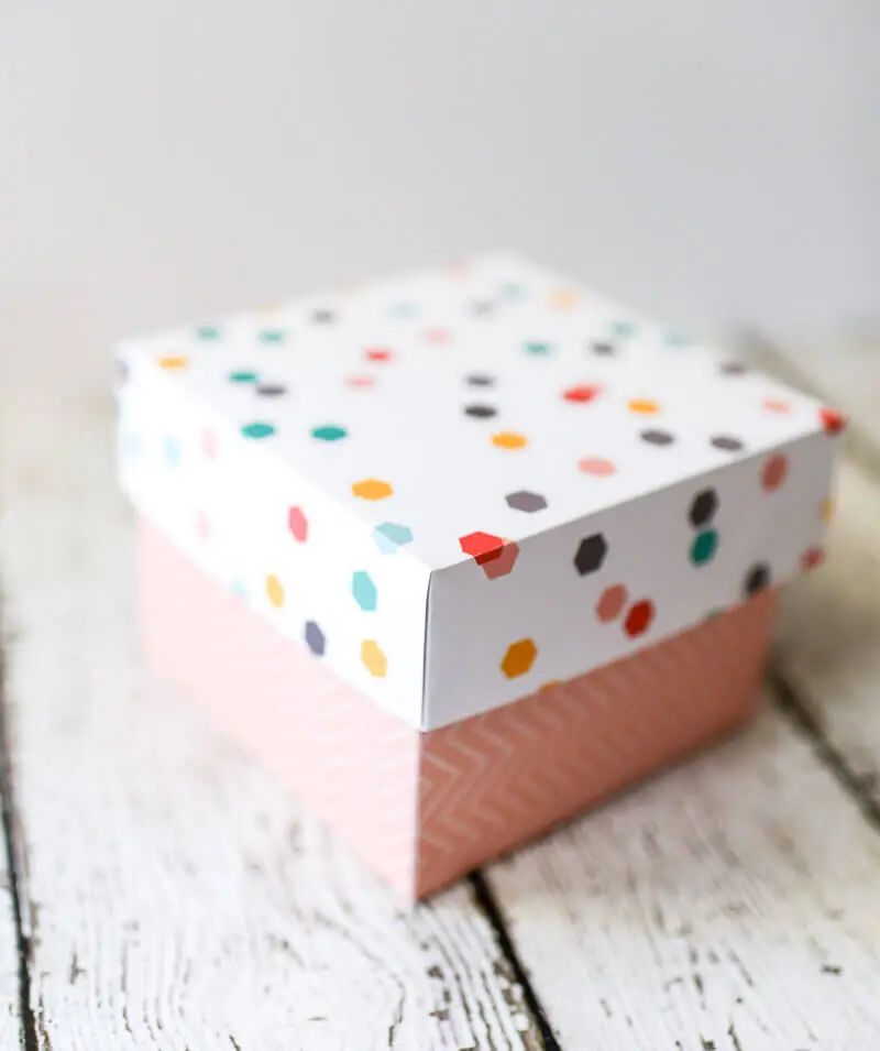 Cardstock gift box in contrasting but coordinating design schemes